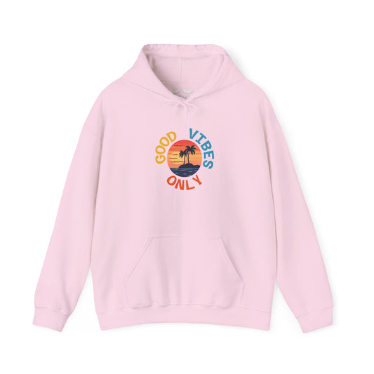 Light pink hoodie with circular sunset graphic and curved “Good Vibes Only” text on front, tropical palm beach design